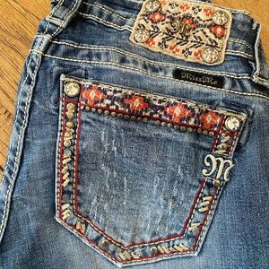 Miss Me mid-rise bootcut jeans. Size 25.